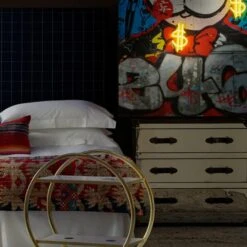 Andrew Martin Sale Store -Andrew Martin Sale Store 58469 sage headboard in wales navy with howard steelleather chest of drawers a cici bar trolley and micky mouse and monopoly man neon artwork